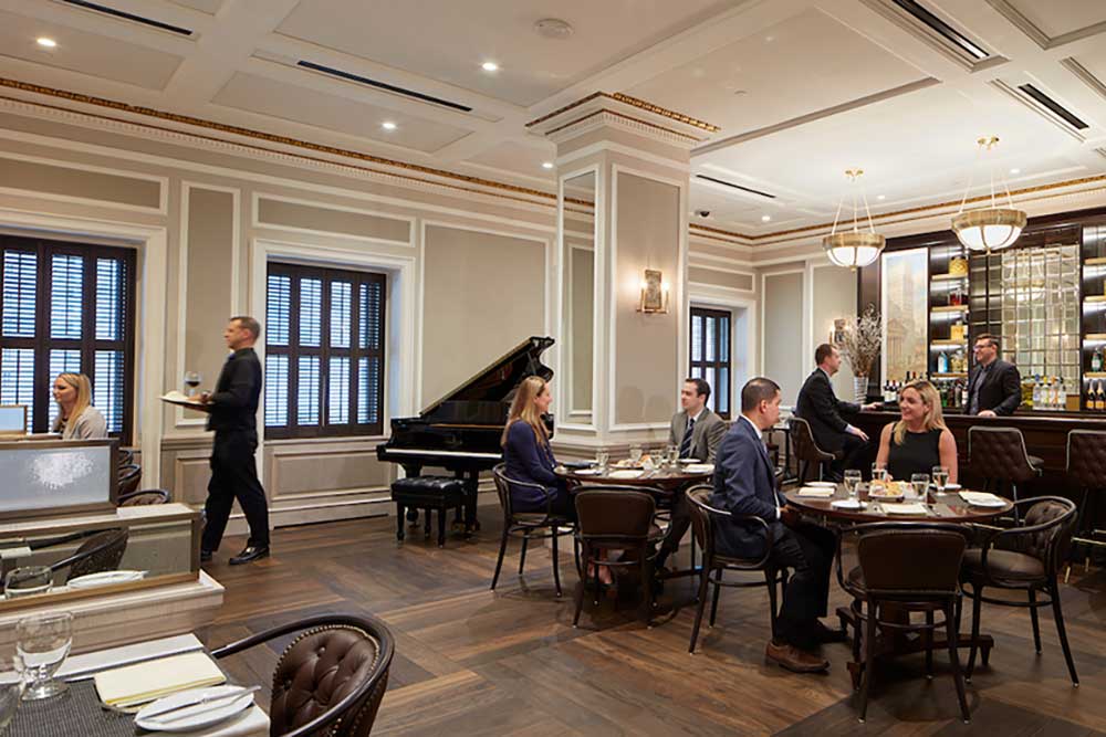 NYSE 1792 Restaurant with seated guests and a waiter