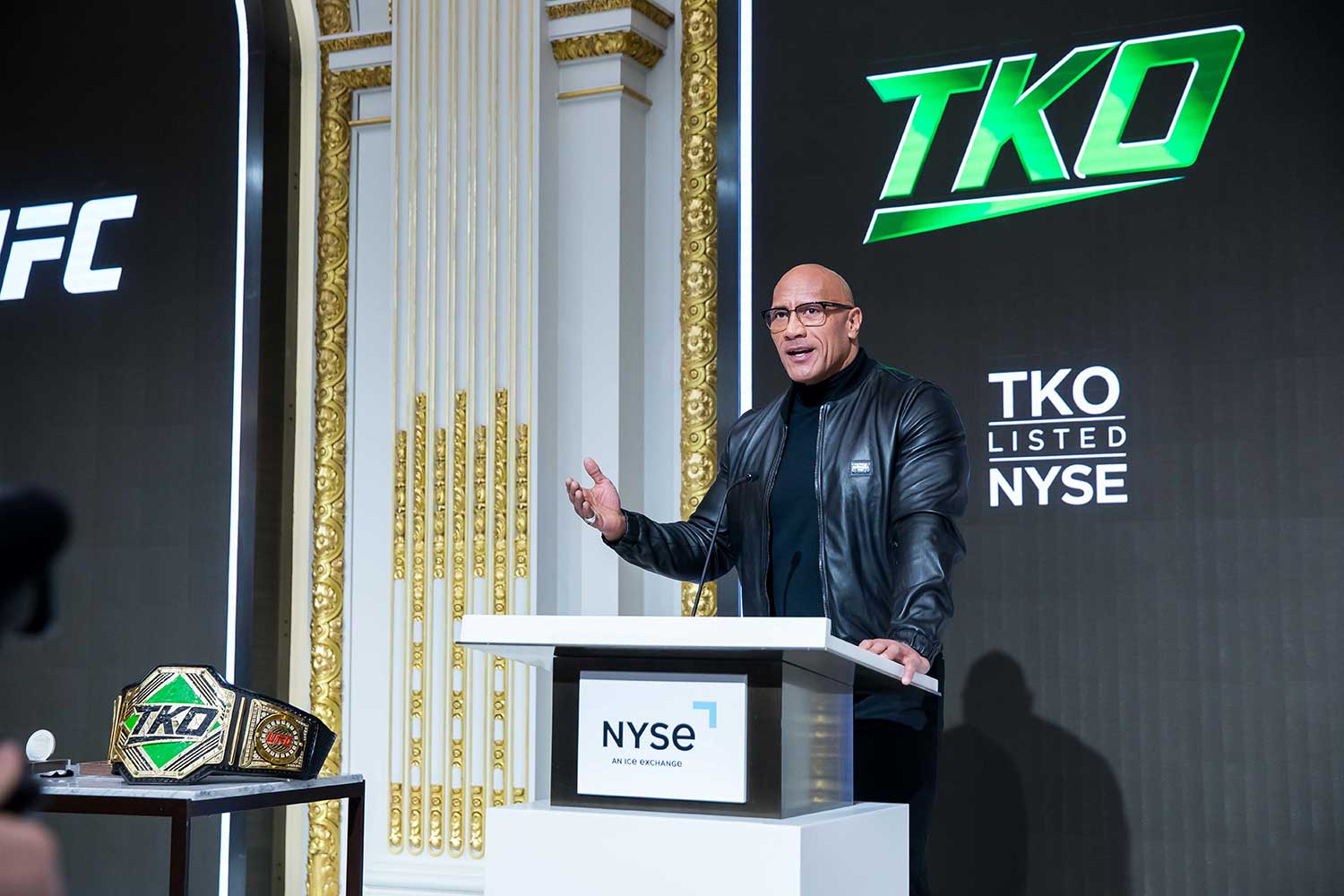 TKO listed on NYSE - The Rock speaking behind a podium