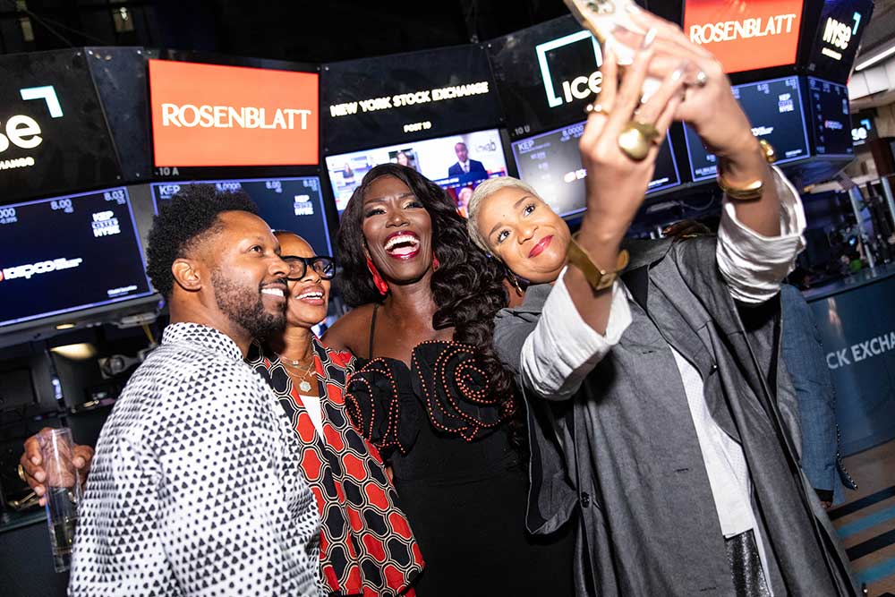 NYSE Fashion Week reception - 4 people take a selfie on the trading floor of the NYSE